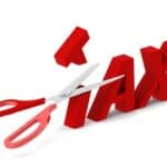 Scissors cutting through the word 'TAX' symbolising tax reduction.