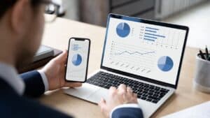 Landlord Today analytics on mobile and laptop screens for property management.