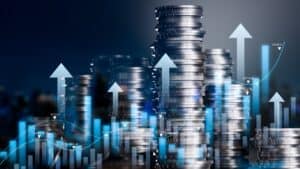 Stacks of coins with upward arrows symbolising financial growth for landlords.
