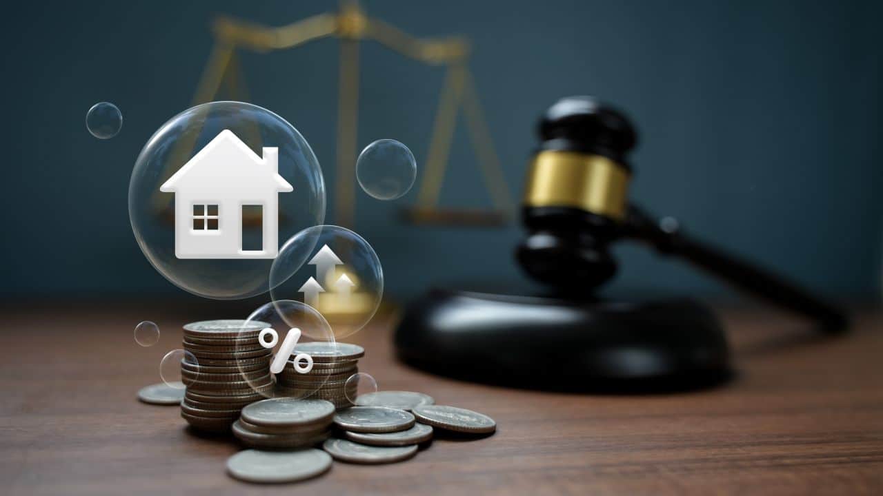 House icon with coins and gavel representing property law and investment.