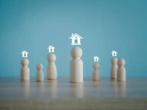 Figurines representing property management and landlord-tenant relationships.