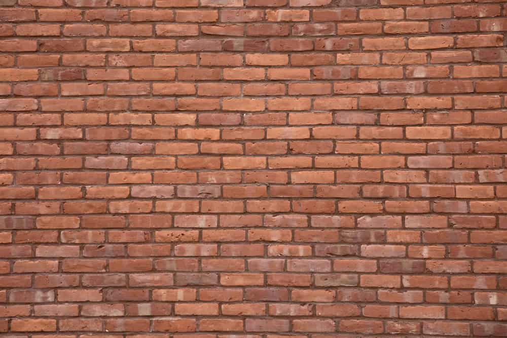 Red brick wall background for property and landlord articles.